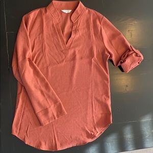 Notch-neck roll tab blouse
